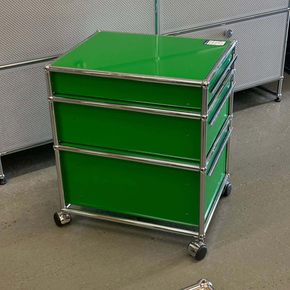 USM Haller Rollcontainer in green with three drawers and caster wheels