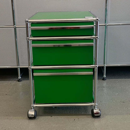Green USM Haller Rollcontainer with three drawers and chrome frame on wheels