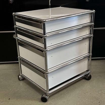 USM Haller Rollcontainer in light gray with four drawers and partial locking system on casters