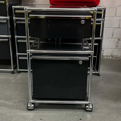 USM Haller black rollcontainer with two drawers and chrome frame on casters