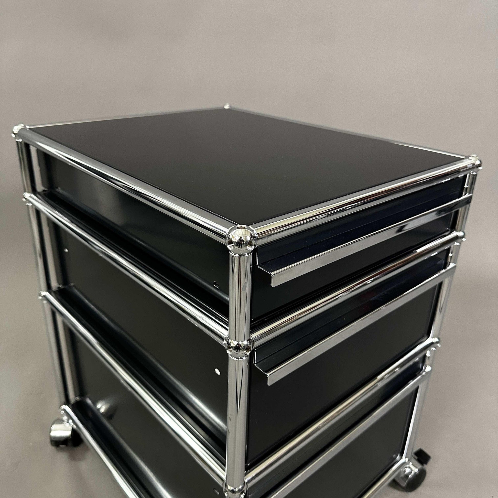 Black USM Haller Rollcontainer with three drawers and chrome frame on wheels