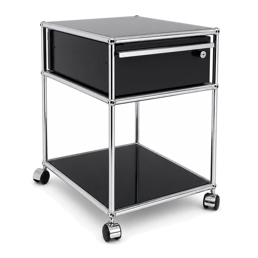 USM Haller Rollcontainer in Graphitschwarz mit Chromrahmen, einer Schublade und Ablagefläche auf Rollen.