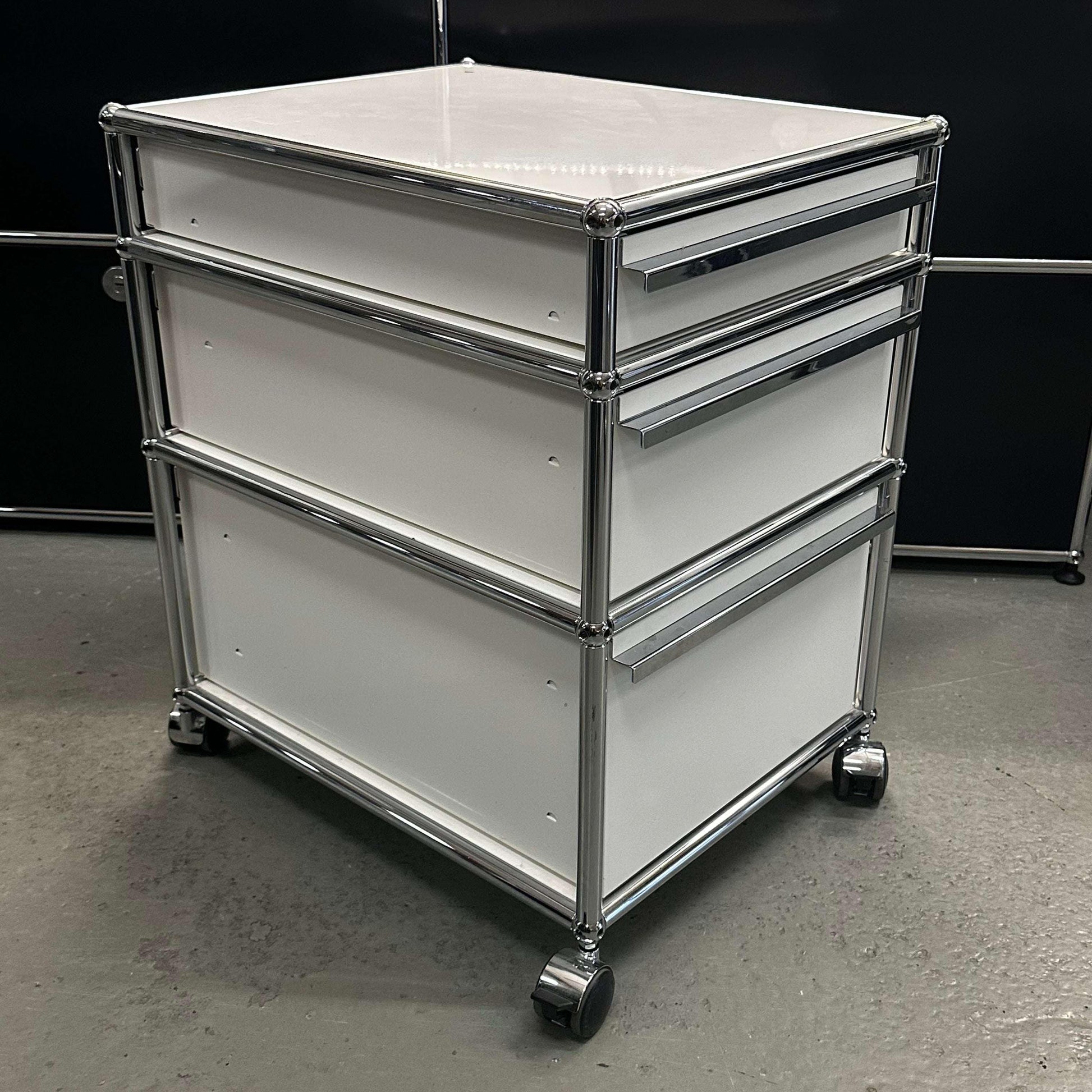 USM Haller Rollcontainer in pure white with chrome frame and caster wheels