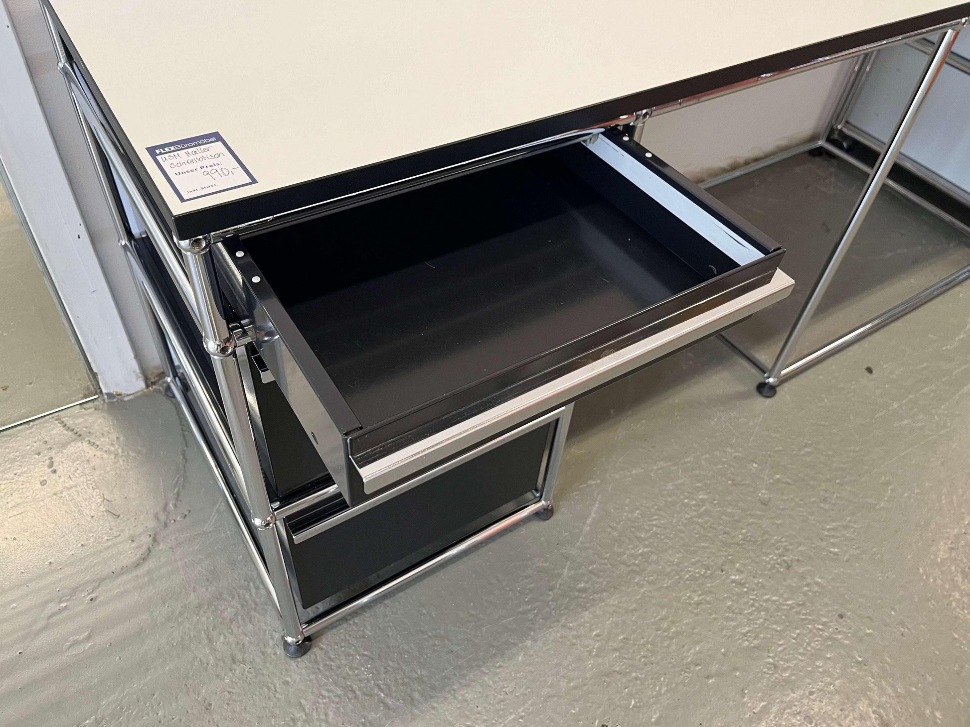 USM Haller desk with graphit black drawer unit and perlgrau tabletop with black edge