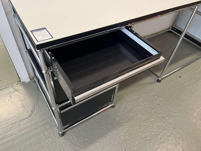 USM Haller desk with graphit black drawer unit and perlgrau tabletop with black edge