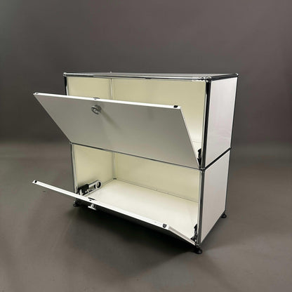 USM Haller white sideboard with two drop-down doors and steel frame
