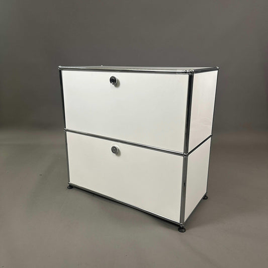 USM Haller white sideboard with two compartments and drop-down doors in modern design