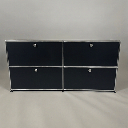 USM Haller Sideboard 2x2 in graphite black with four flap doors and chrome frame, measuring 153x75x38 cm