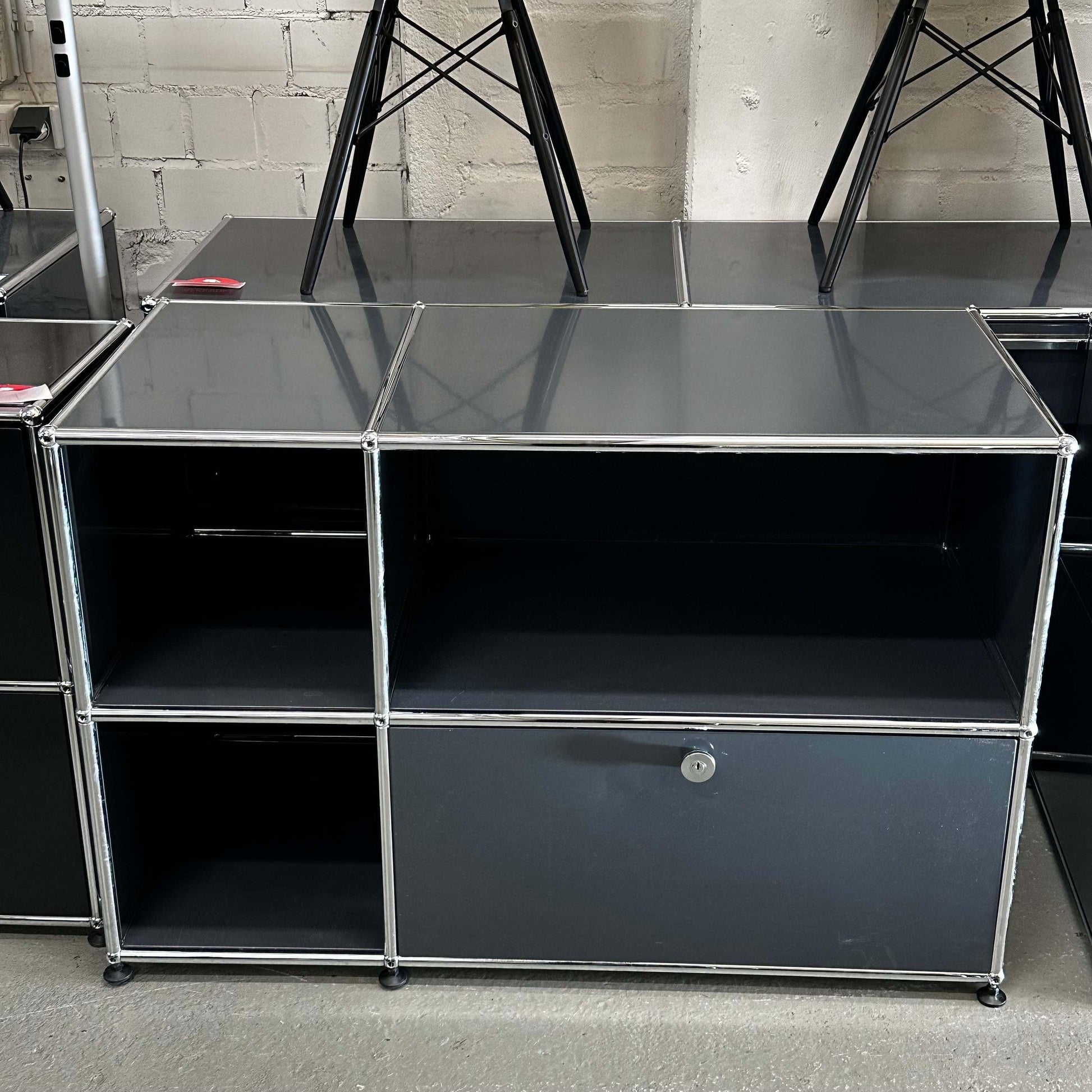 USM Haller Sideboard anthracite with modular compartments and metal frame in industrial setting