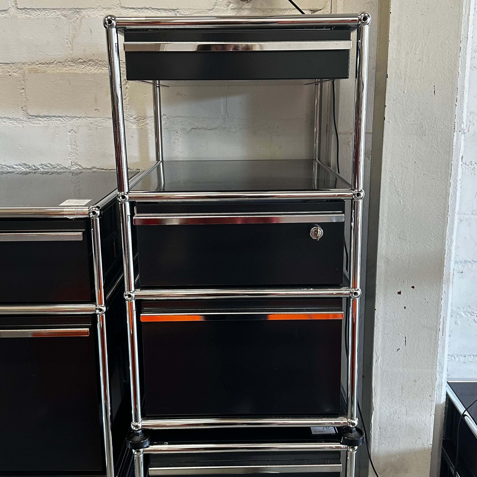 Black USM Haller stand container with three drawers and chrome frame