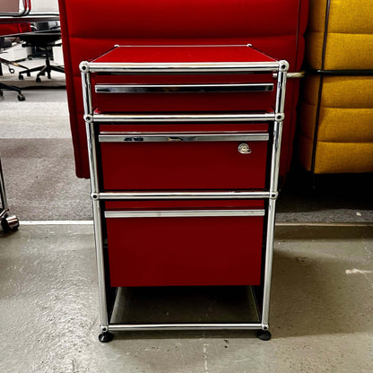 USM Haller Standcontainer in ruby red with three drawers and chrome frame