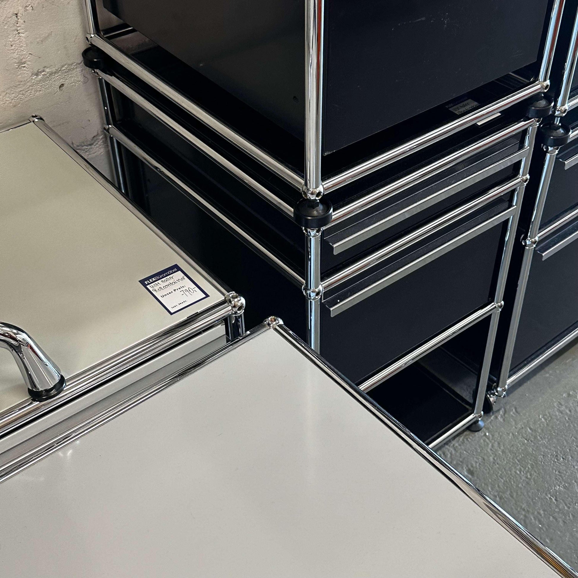 Black USM Haller Standcontainer with 2 drawers and chrome frame in office setting