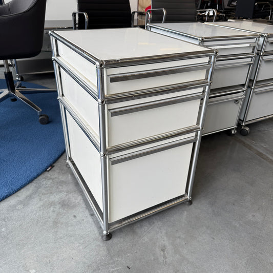 USM Haller white standcontainer with three drawers and chrome frame in office setting