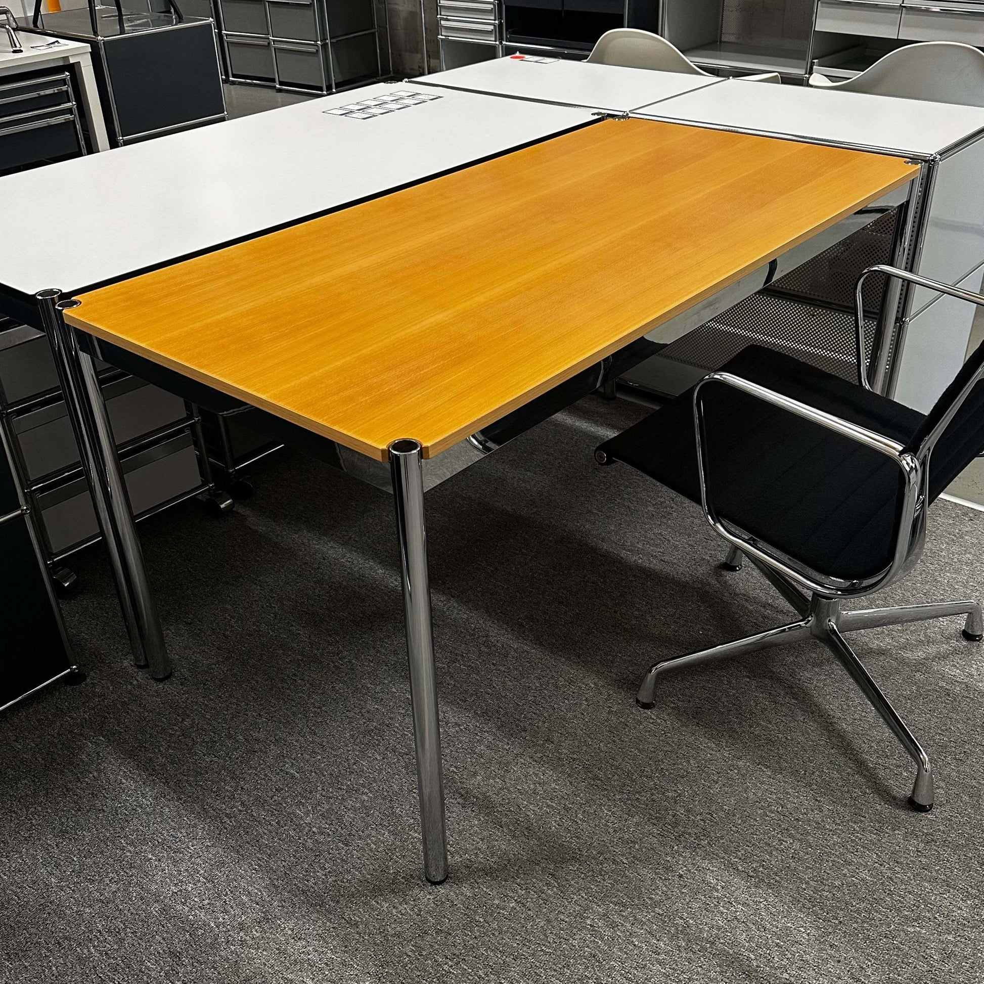 USM Haller Tisch 150x75cm with beech wood top and chrome frame in office setting