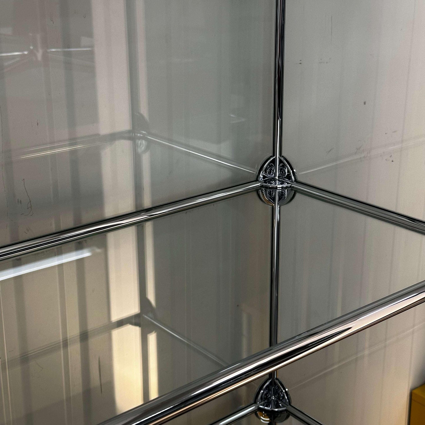 USM Haller Vitrine black with glass panels and foldable door close-up detail