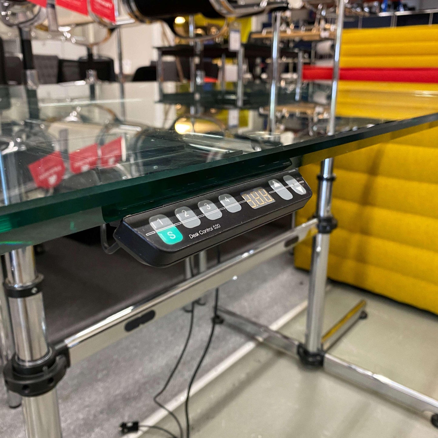 USM Kitos electric height-adjustable desk with glass tabletop and control panel