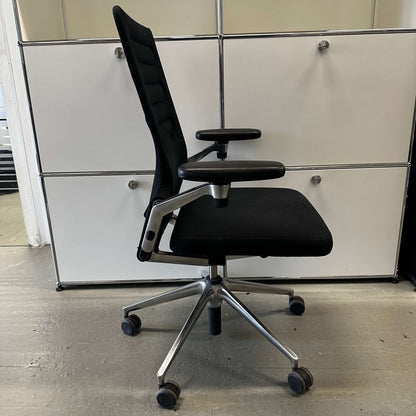 Vitra AC 4 ergonomic black office chair with chrome frame and adjustable armrests on caster wheels