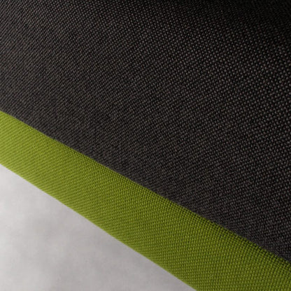 Close-up of green and gray fabric upholstery of Vitra Alcove Highback 2-seater sofa with durable recycled polyester material