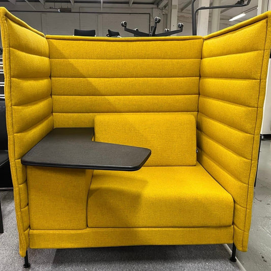 Yellow Vitra Alcove Highback Work chair with high padded walls and attached black work surface in modern office setting