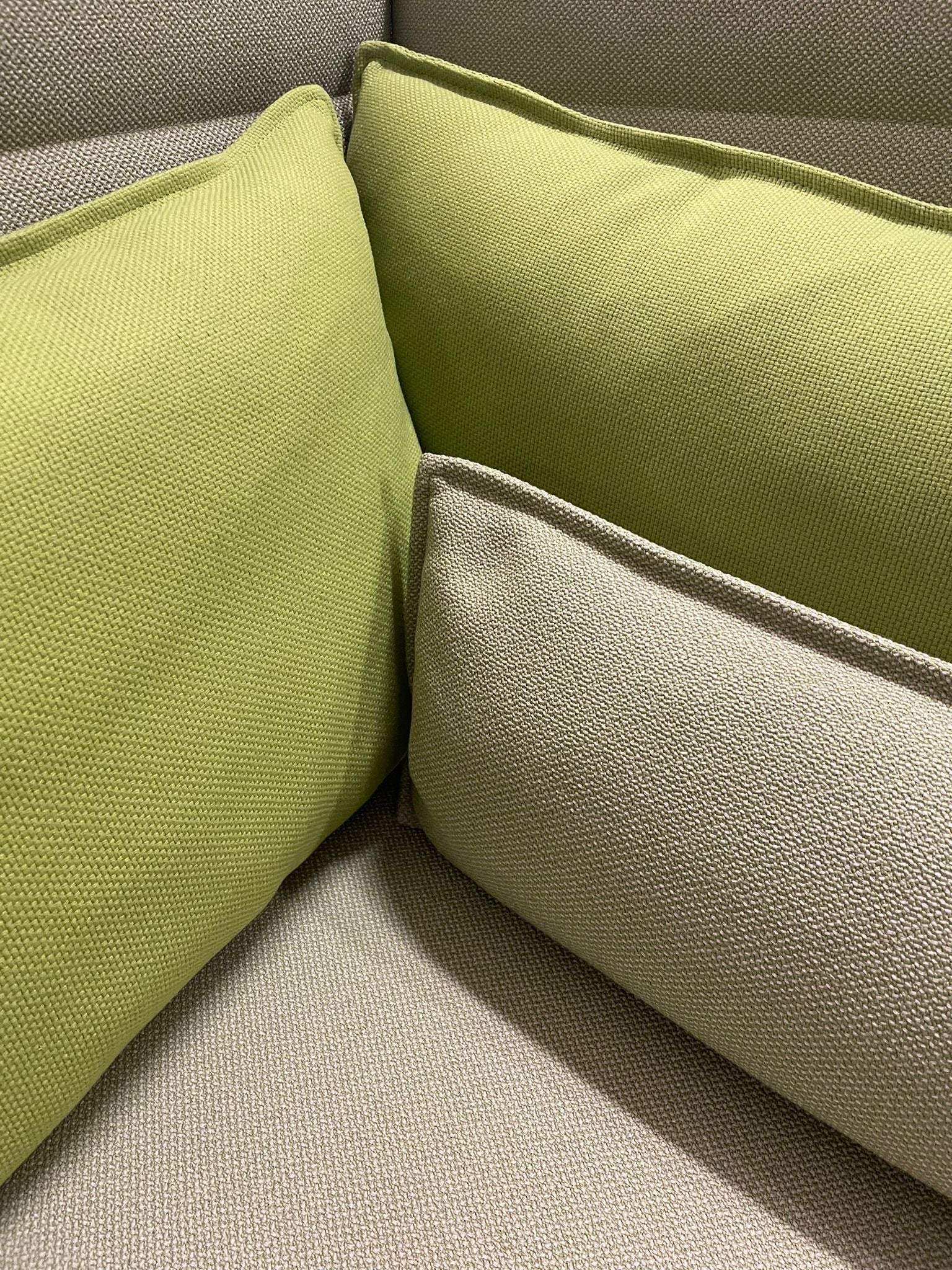Close-up of green and beige cushions on Vitra Alcove Lowback Love Seat upholstery