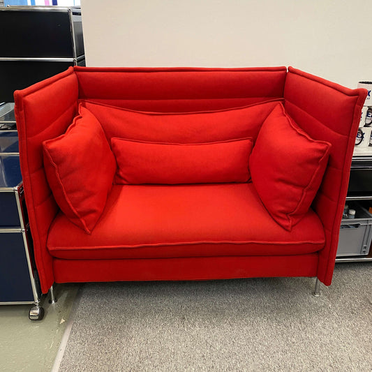 Red Vitra Alcove Lowback Love Seat with cushions and metal legs on gray carpet