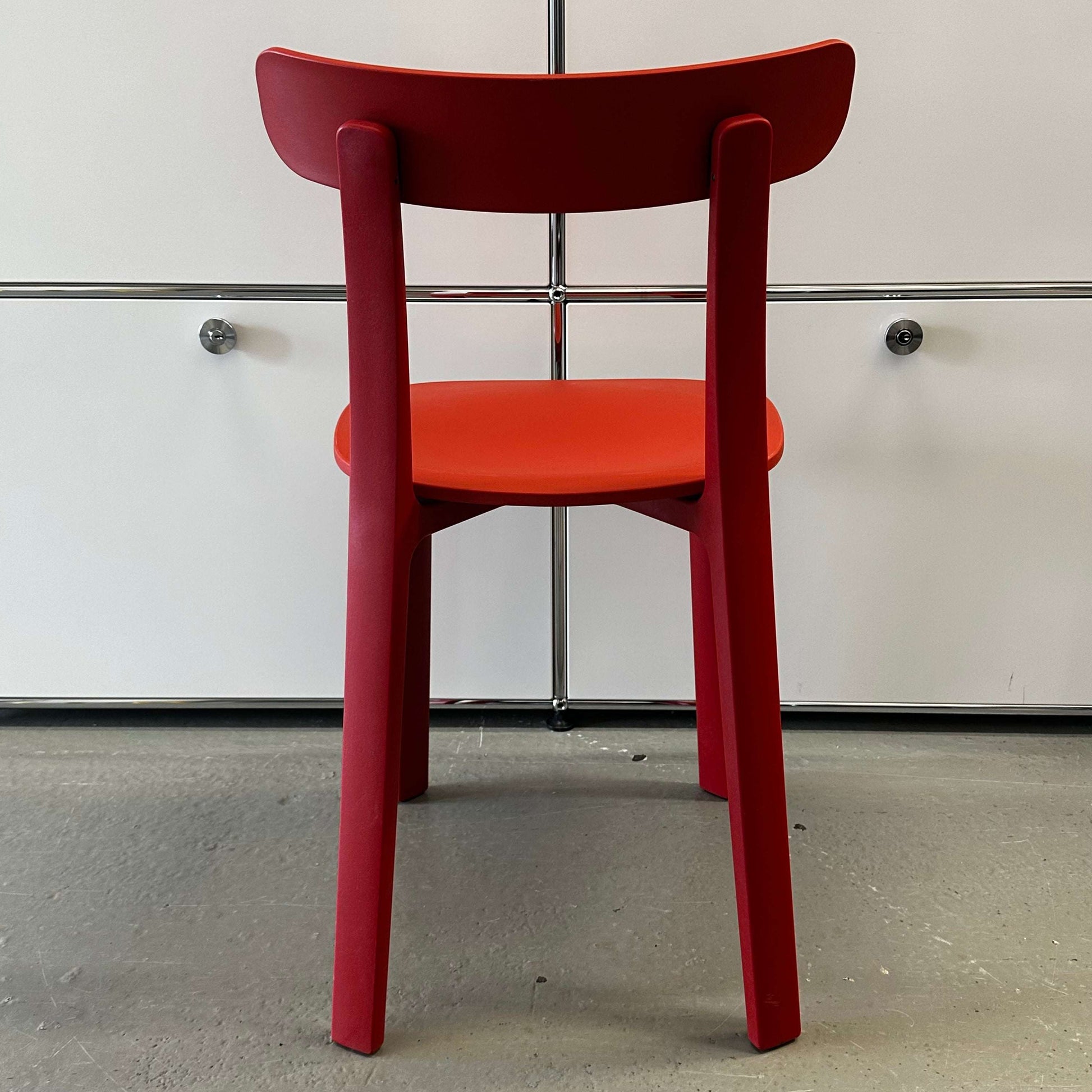 Vitra All Plastic Chair in Backstein color with minimalist design and durable plastic construction viewed from the back