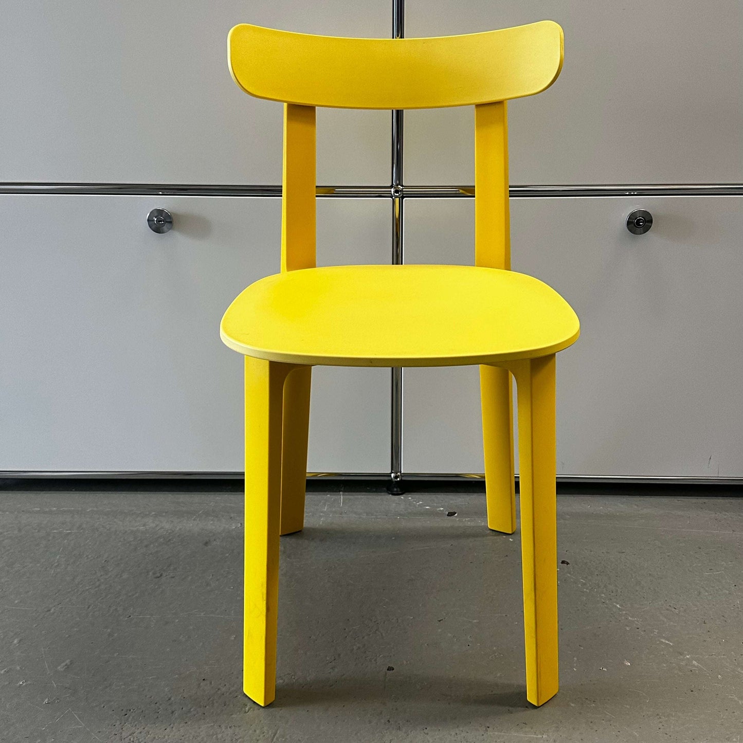 Vitra All Plastic Chair in bright butterblume yellow with minimalist modern design and durable plastic construction for indoor and outdoor use
