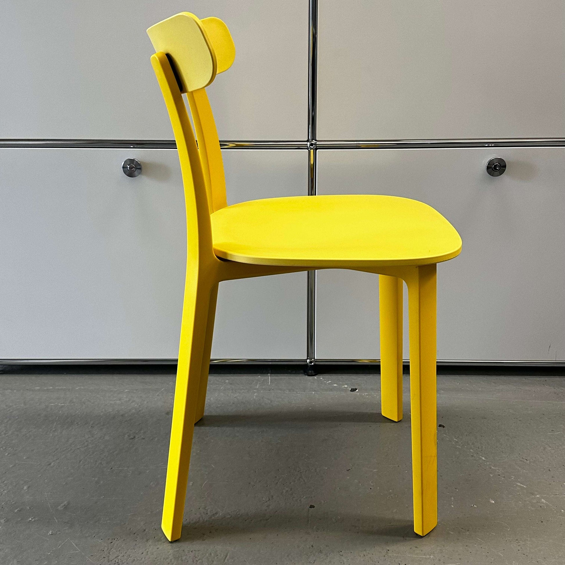 Vitra All Plastic Chair in bright butterblume yellow with minimalist design and durable plastic construction