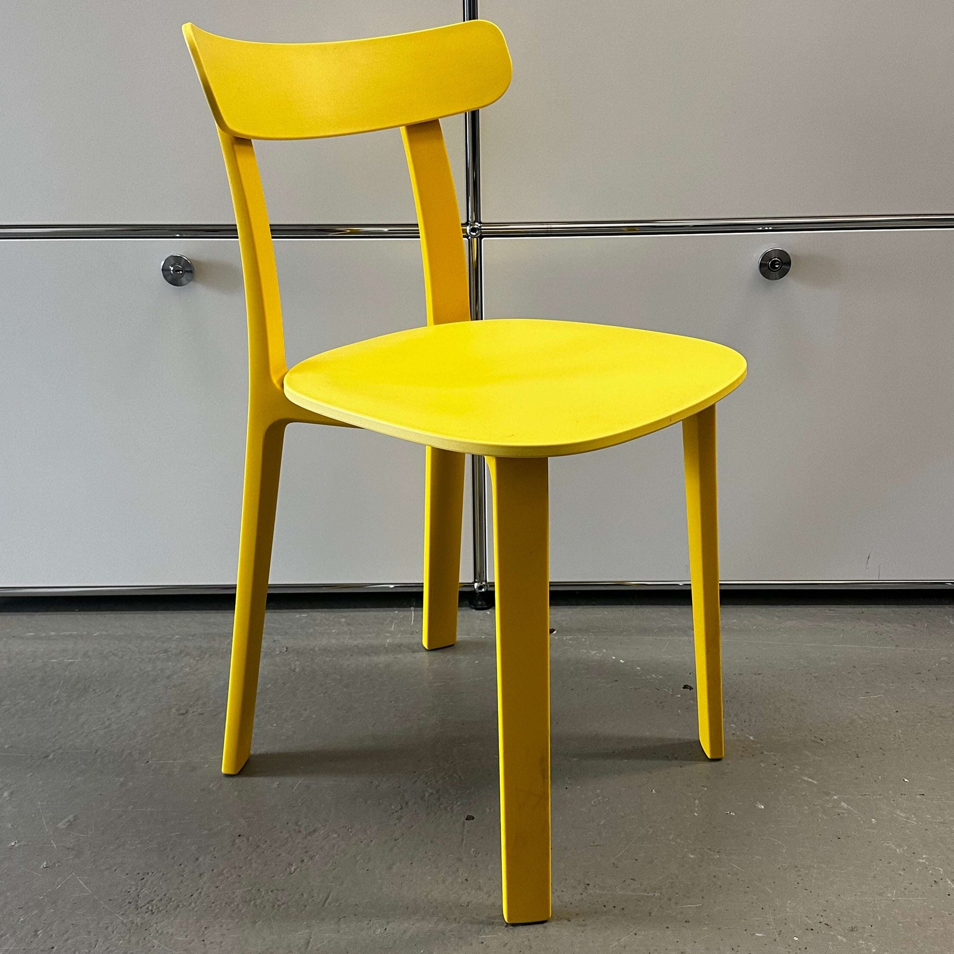 Vitra All Plastic Chair in bright Butterblume yellow with minimalist design for indoor and outdoor use