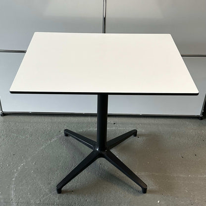 Vitra Bistro Table with white rectangular top and black star-shaped base, suitable for indoor and outdoor use