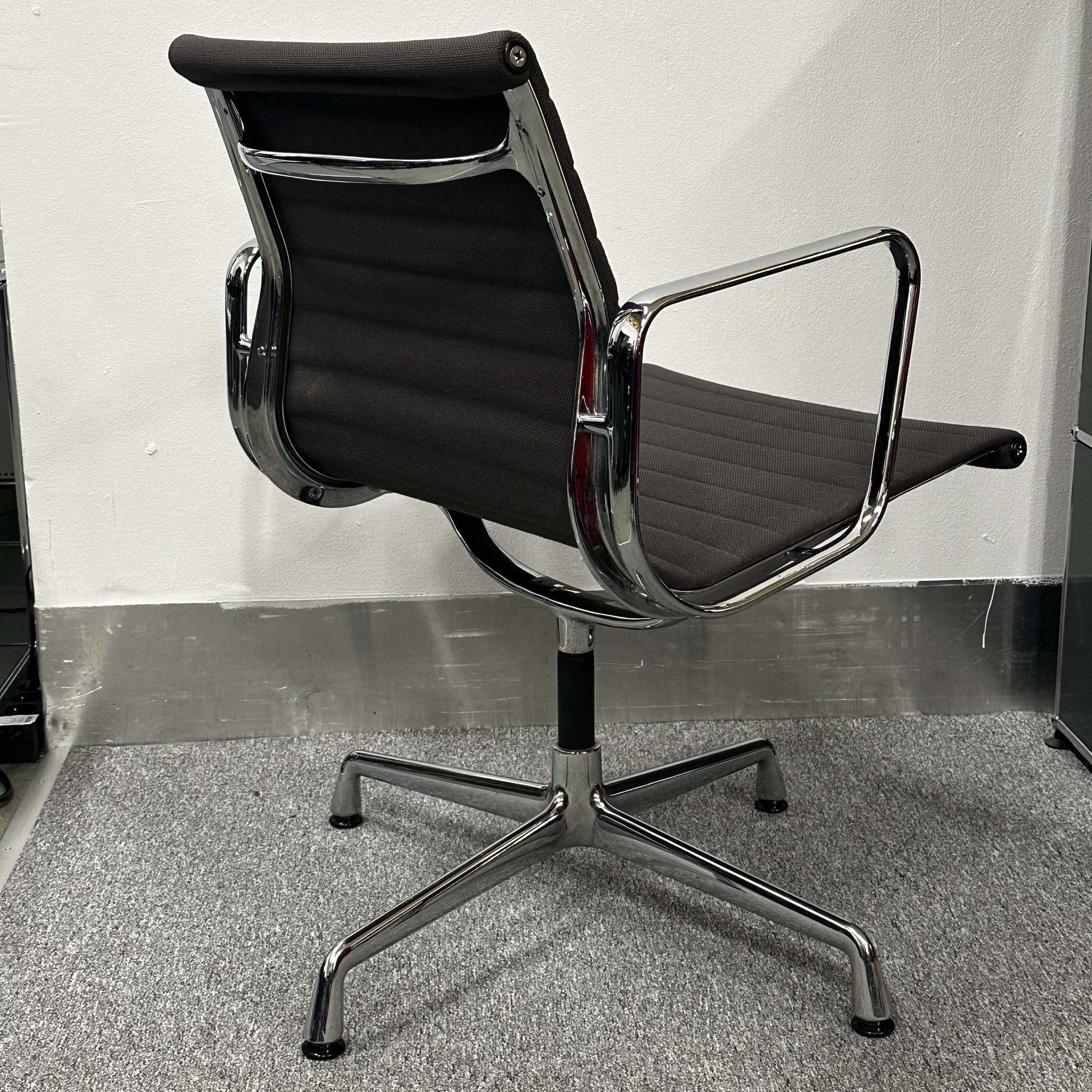 Vitra EA 107 anthracite non-swivel visitor chair with chrome frame and ergonomic design