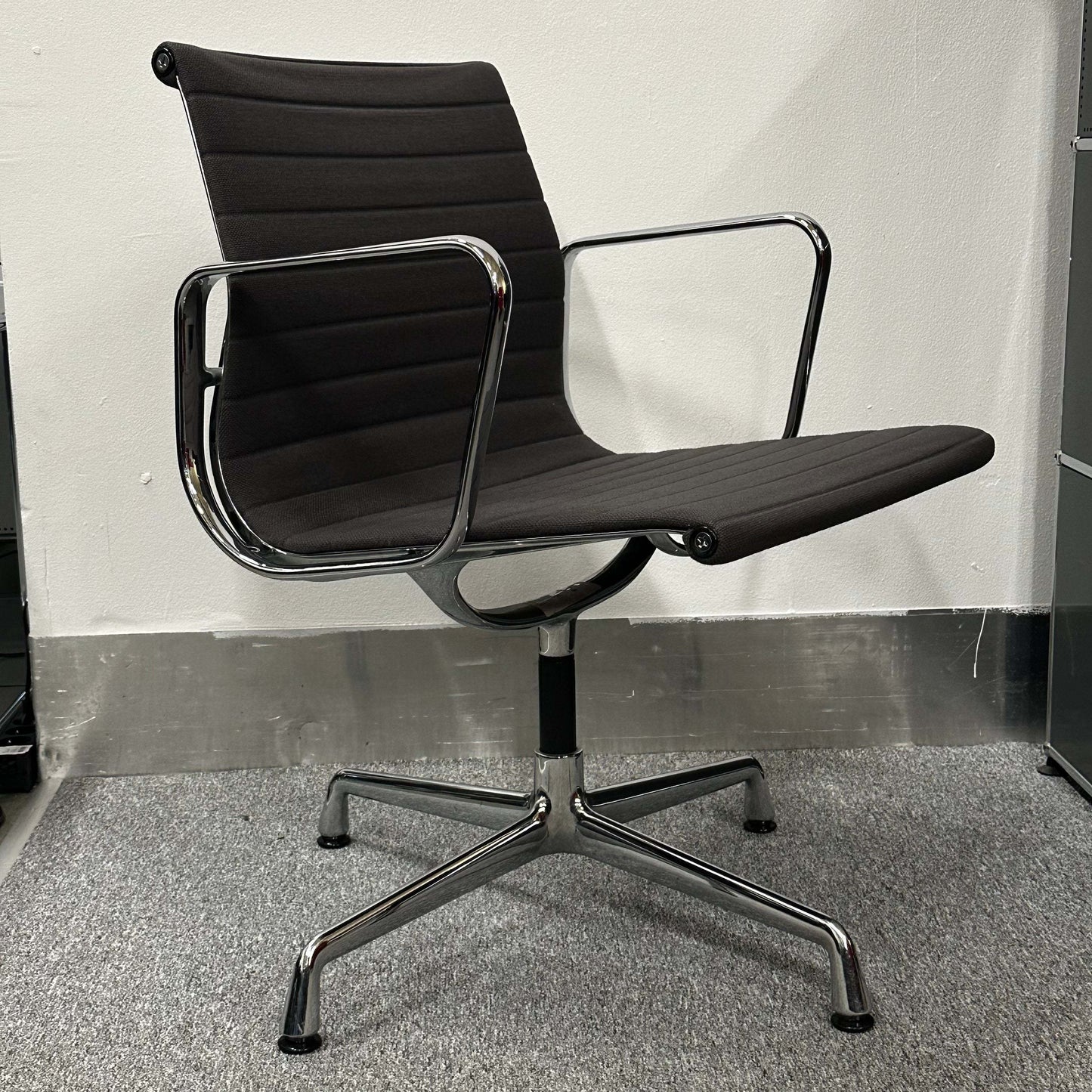 Vitra EA 107 anthracite visitor chair with non-swivel design and chrome frame