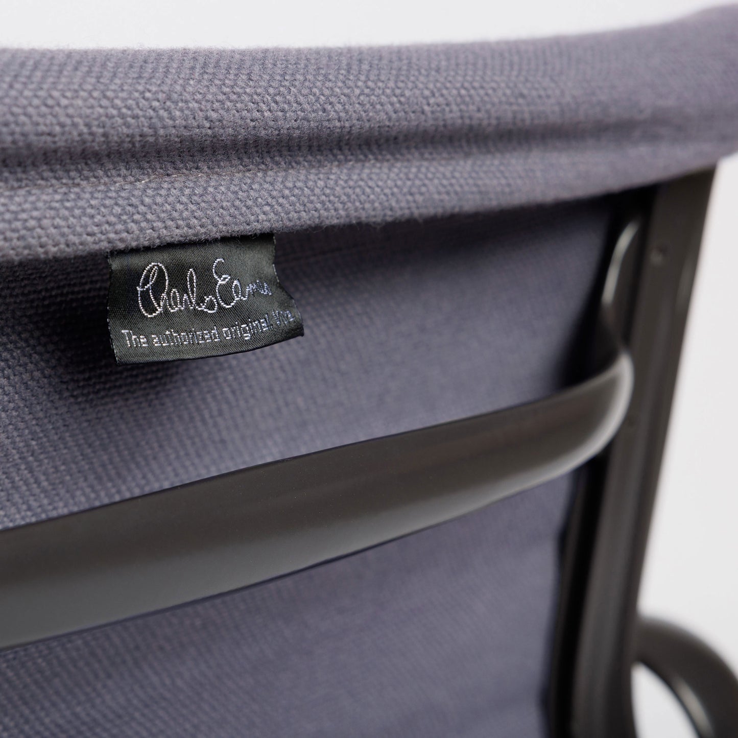 Vitra EA 107 Hopsak chair in flieder-grau with black Charles Eames label.