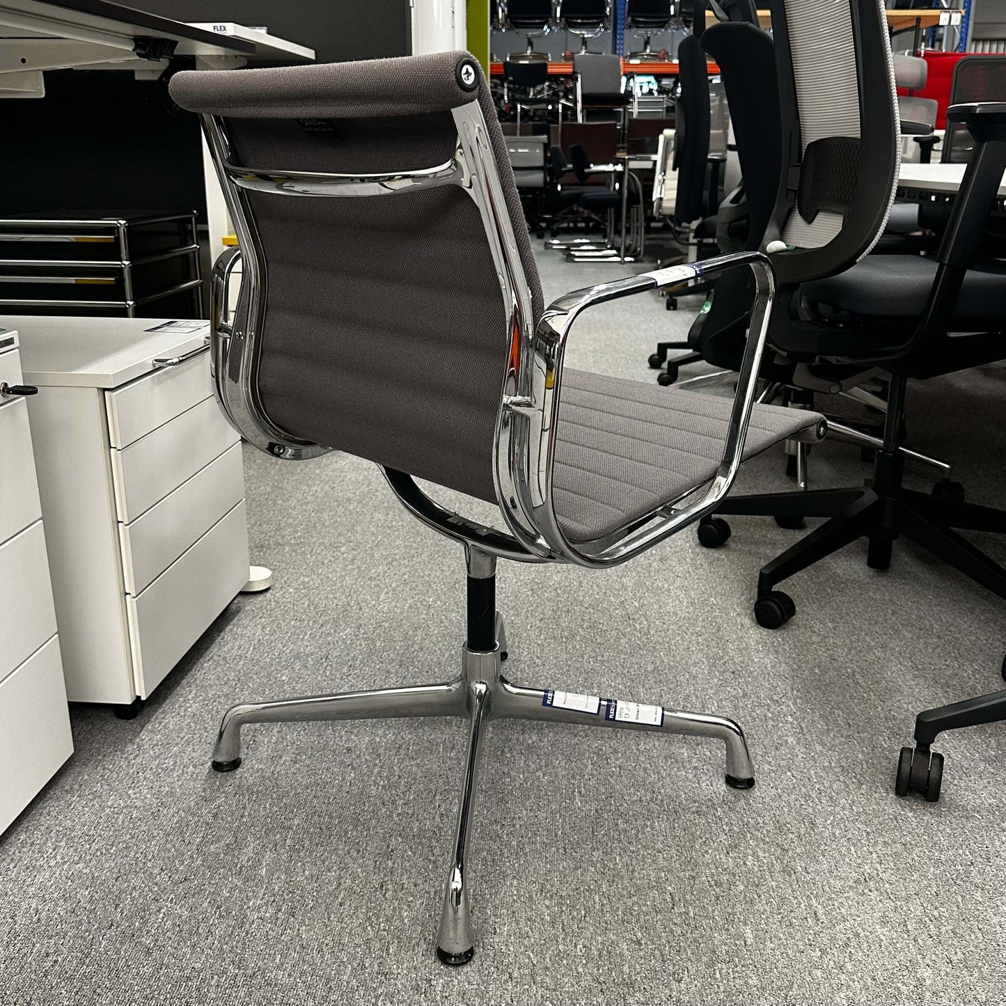 Vitra EA 107 office chair in medium grey hopsak fabric with non-swivel chrome frame
