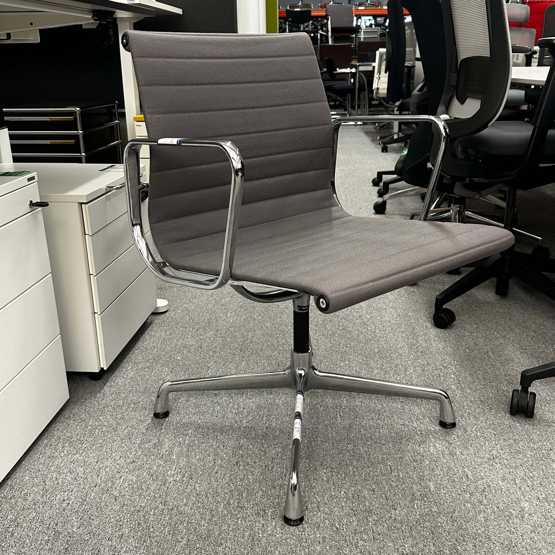 Vitra EA 107 office chair in medium gray hopsak fabric with chrome frame and fixed swivel base