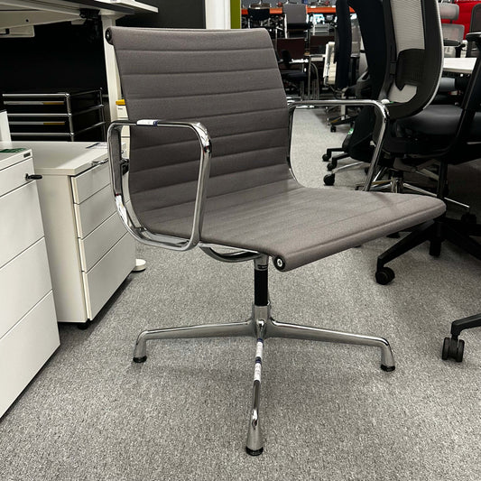 Vitra EA 107 office chair in medium gray hopsak fabric with chrome frame and fixed swivel base