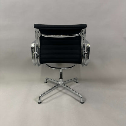 Black Vitra EA 107 Hopsak office chair with chrome aluminum frame, non-swivel design viewed from the back
