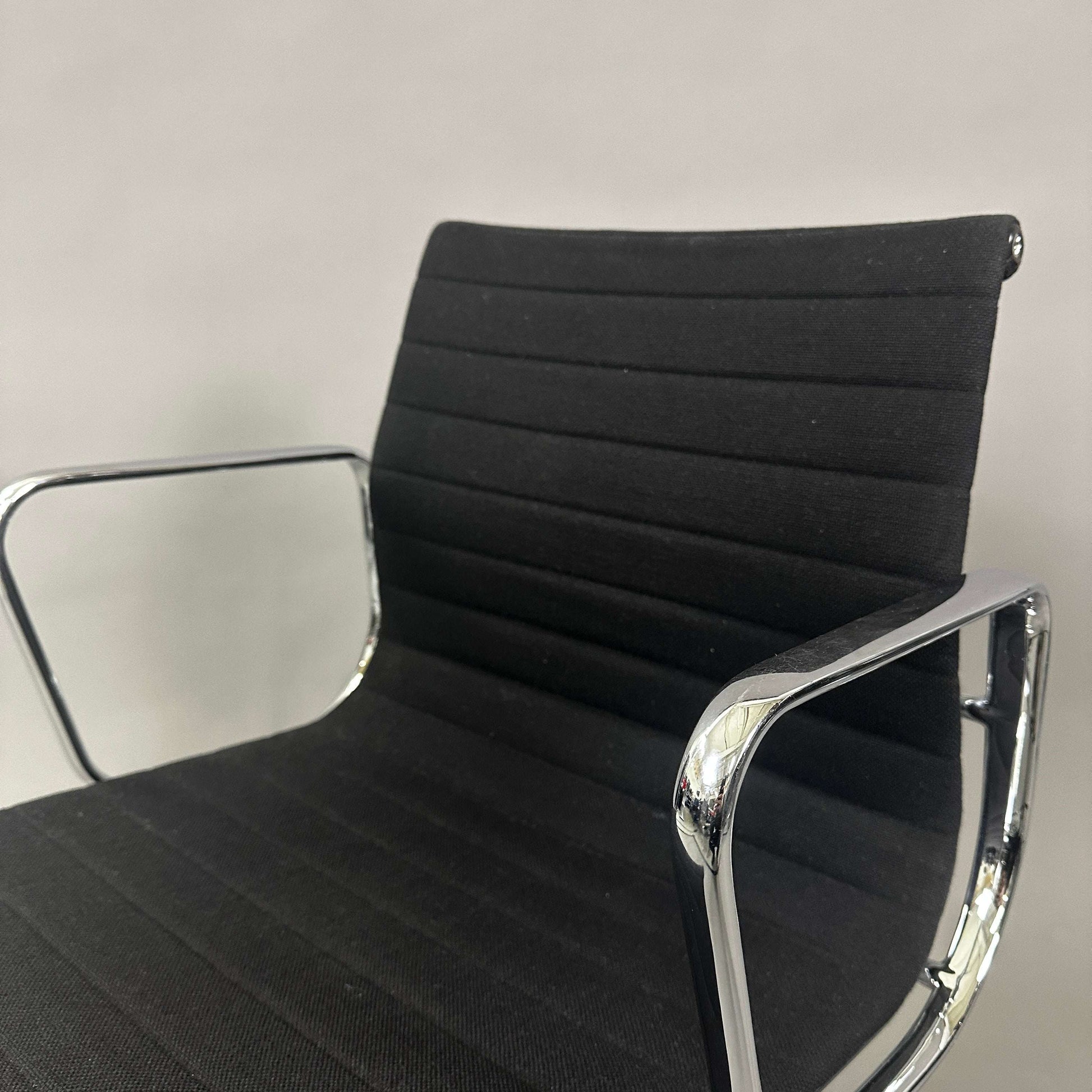 Vitra EA 107 Hopsak black office chair with non-swivel chrome aluminum frame and fabric upholstery