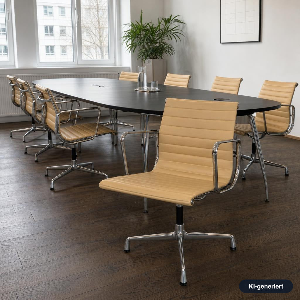 Vitra EA 108 Konferenzstuhl in Cashew-Leder mit verchromtem Gestell an einem ovalen schwarzen Besprechungstisch.
