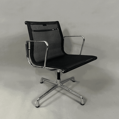 Vitra EA 108 swivel office chair with black mesh seat and chrome frame