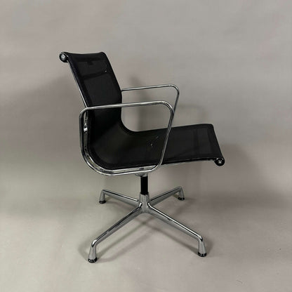 Vitra EA 108 office chair with black mesh seat and backrest, chrome frame, and swivel base