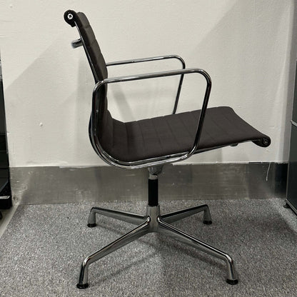 Side view of anthracite Vitra EA 108 swivel office chair with chrome frame and ergonomic design
