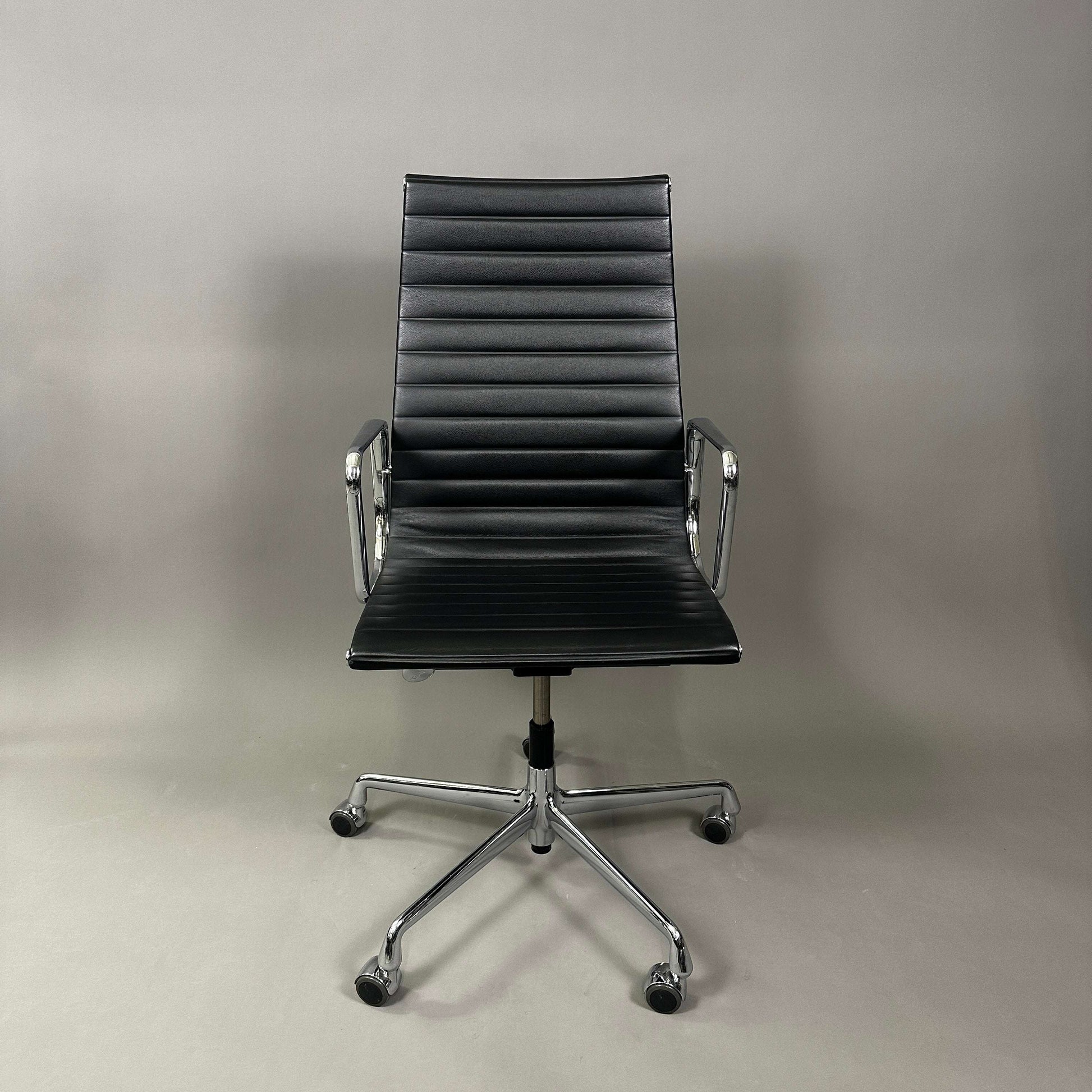 Vitra EA 119 black leather office chair with chrome frame and adjustable tilt function