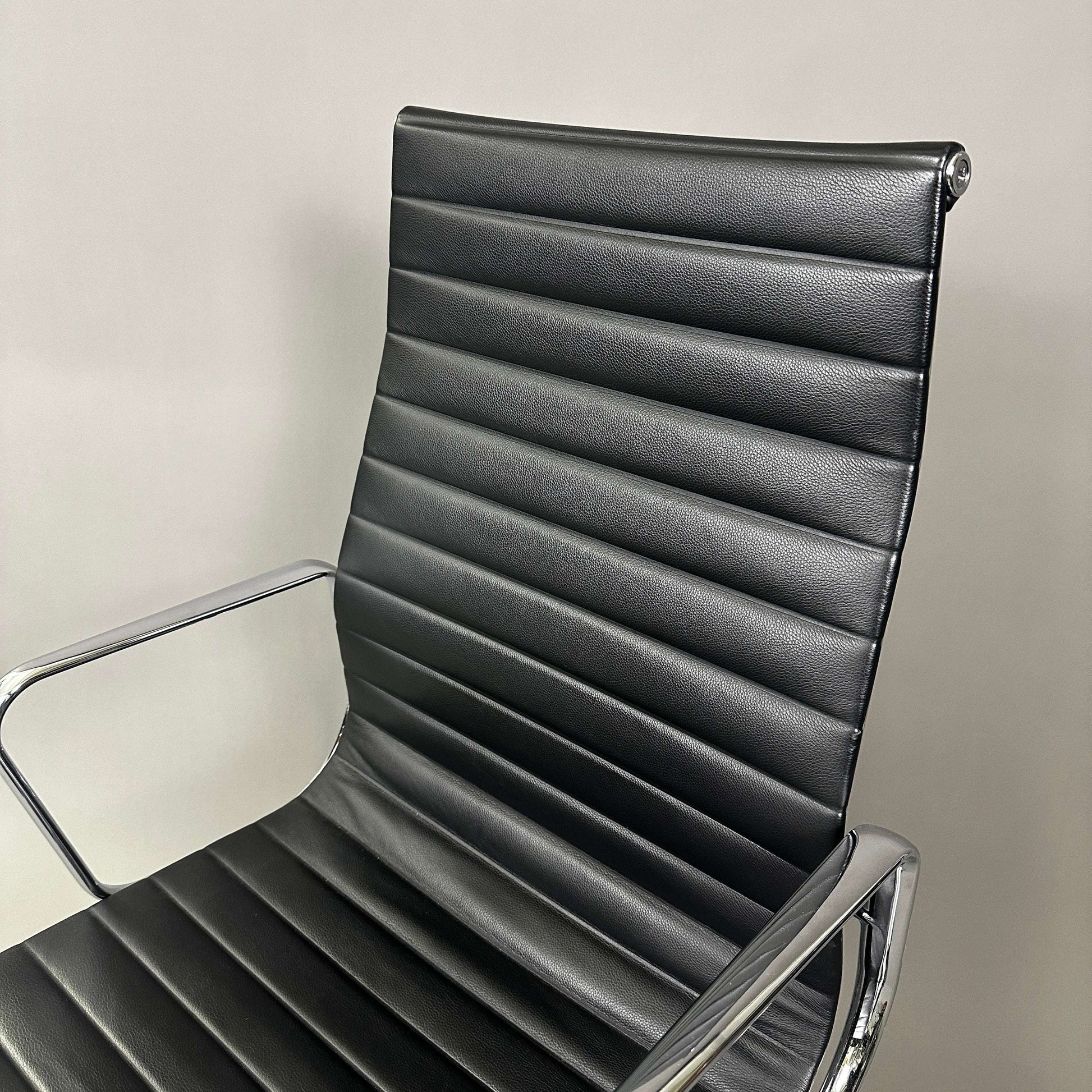 Vitra EA 119 black leather office chair with chrome frame and adjustable tilt function