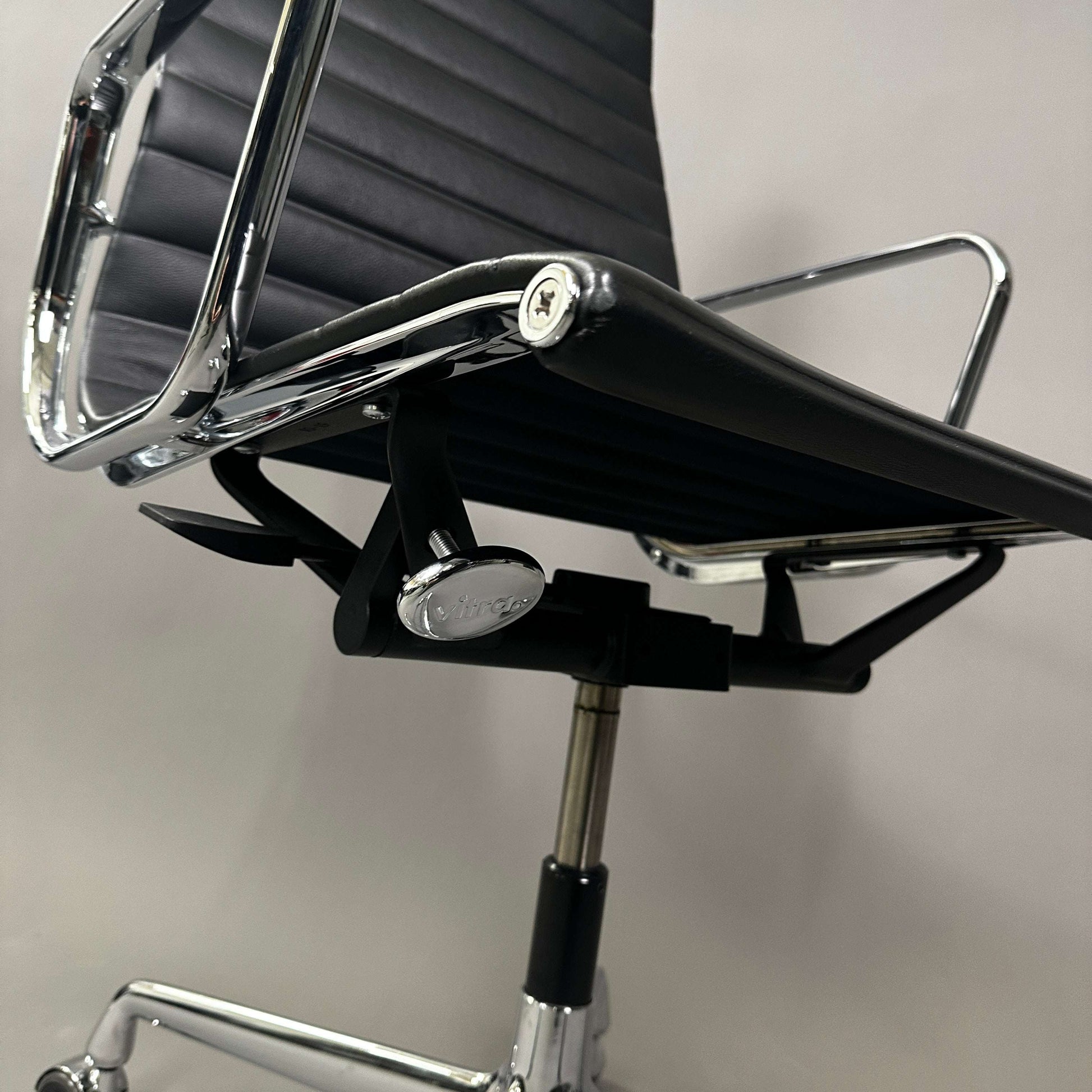 Vitra EA 119 black leather office chair with chrome frame and adjustable tilt function