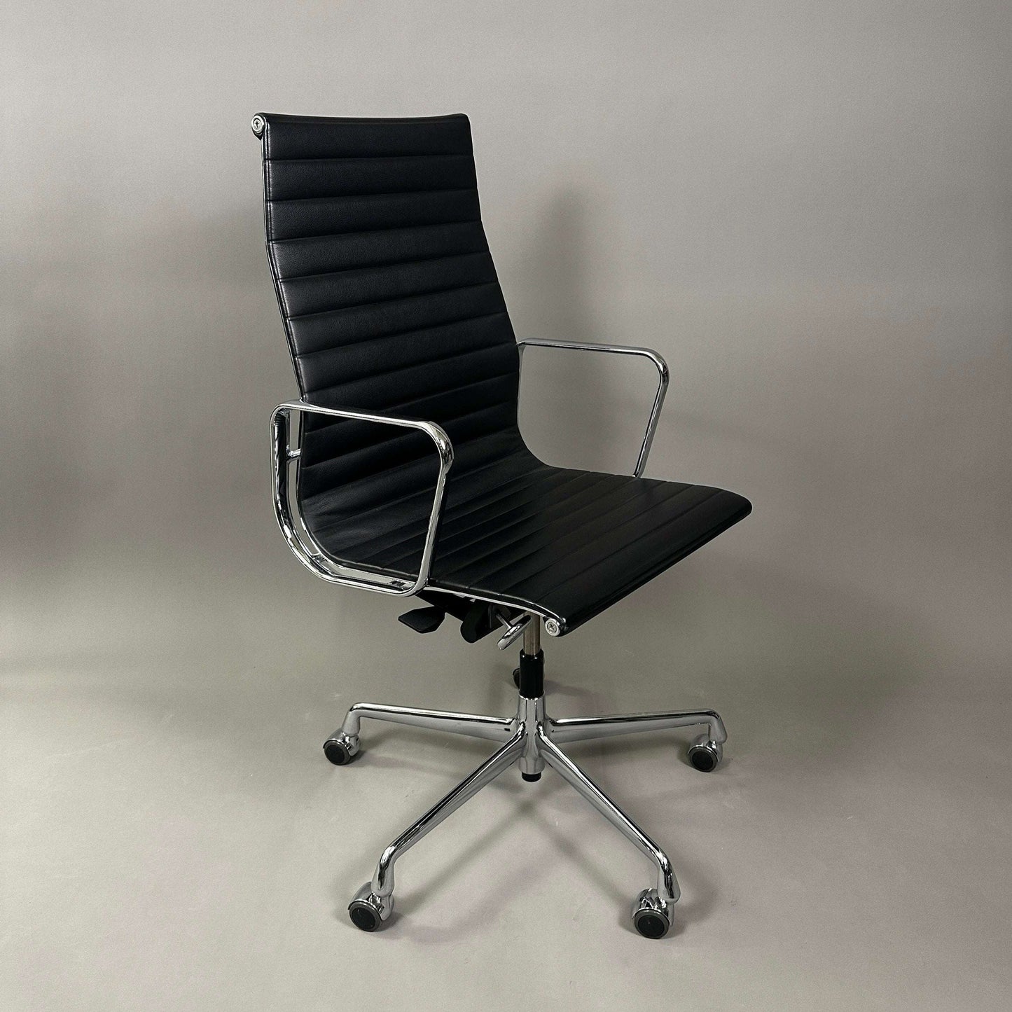 Vitra EA 119 black leather office chair with chrome frame and adjustable tilt function
