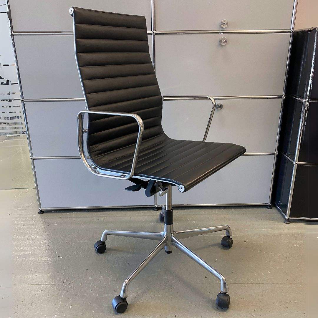 Vitra EA 119 office chair with black leather high back and polished aluminum frame