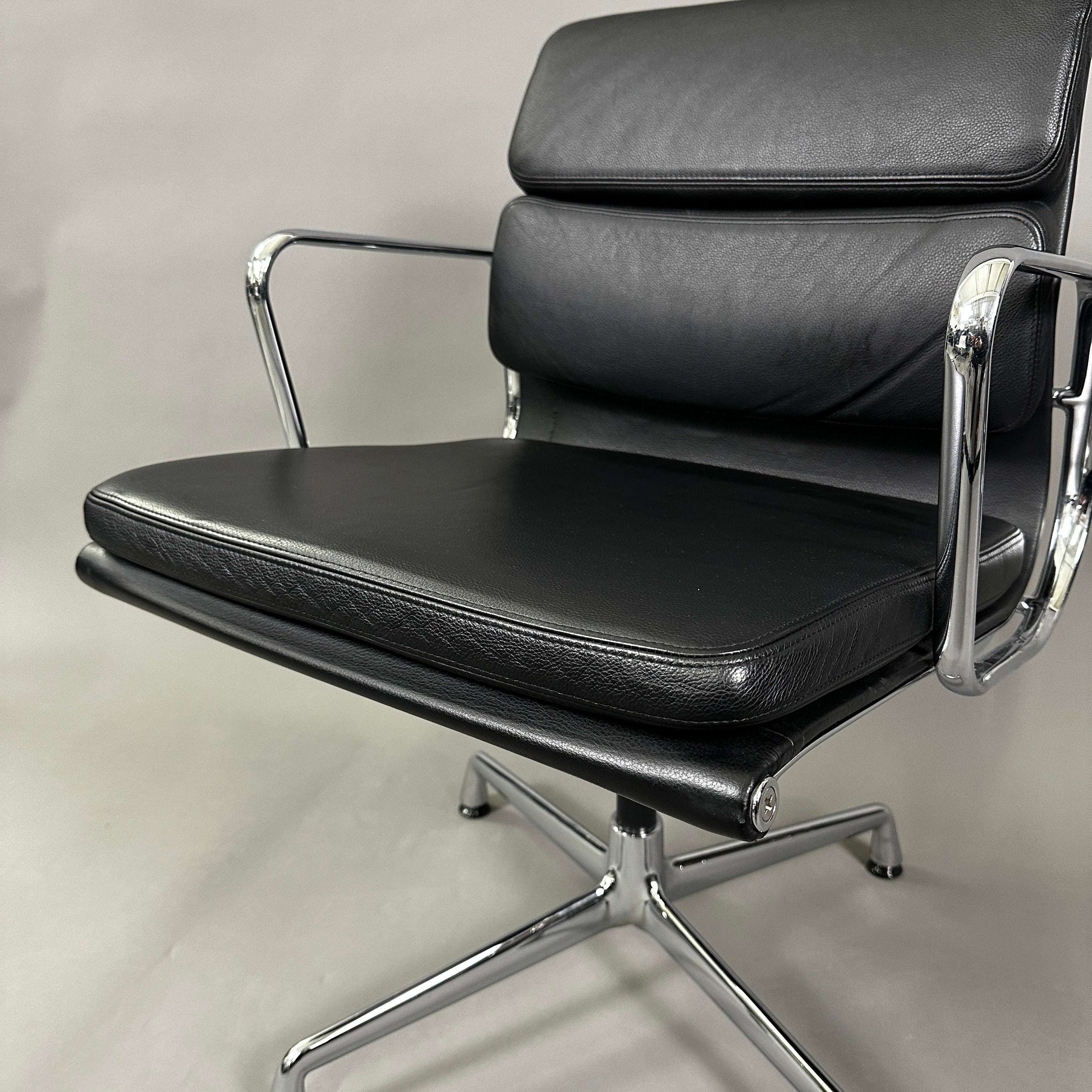 Vitra EA 208 black leather soft pad office chair with chrome frame and swivel base