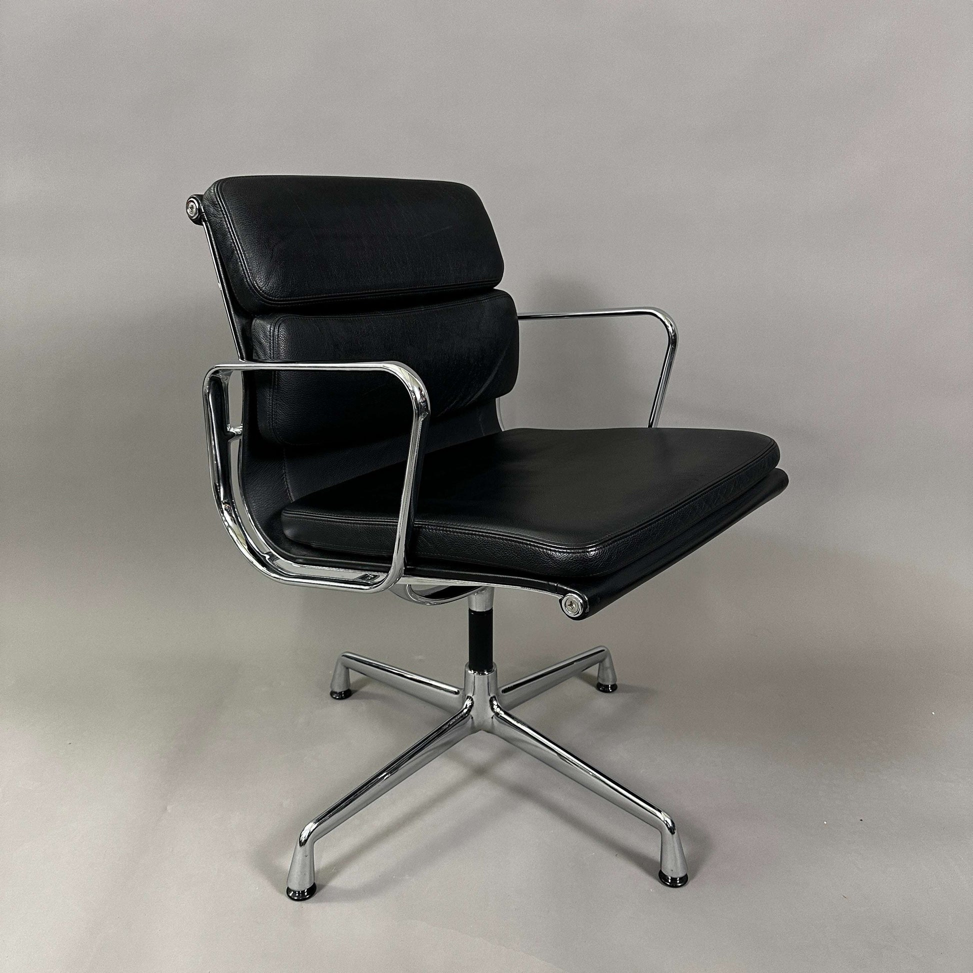 Black Vitra EA 208 Soft Pad Chair with padded leather seat and chrome swivel frame