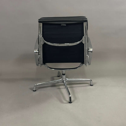 Back view of Vitra EA 216 swivel chair with black soft pad leather and aluminum frame